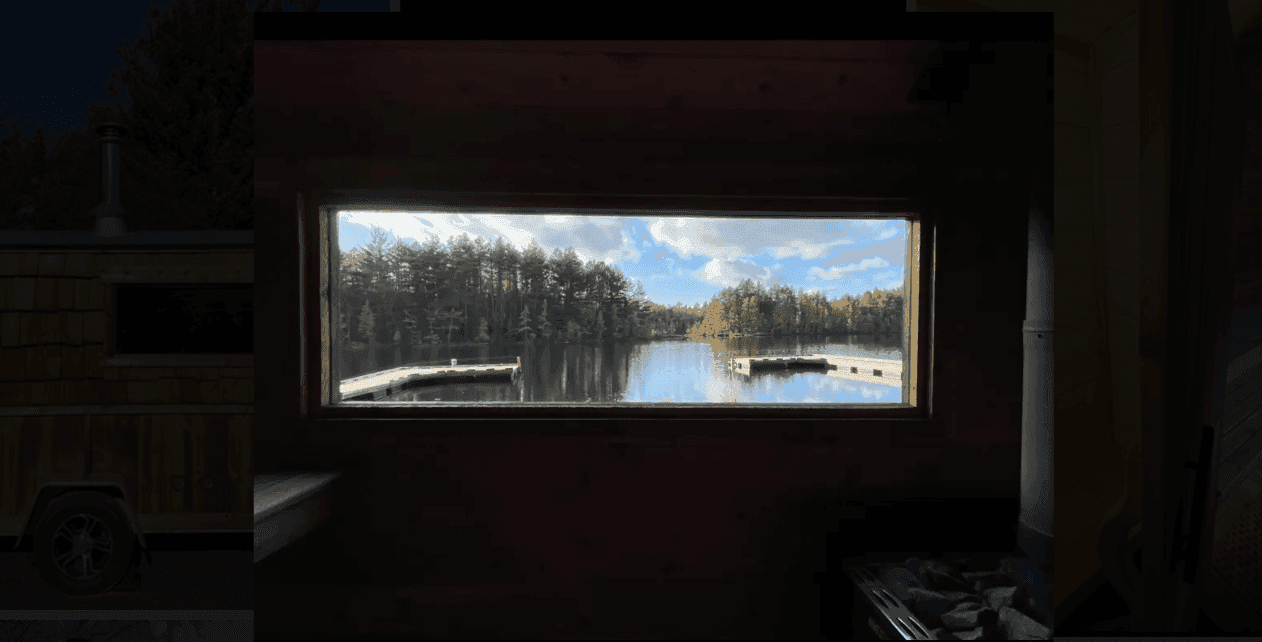 Lake and dock viewed through a rectangular sauna window