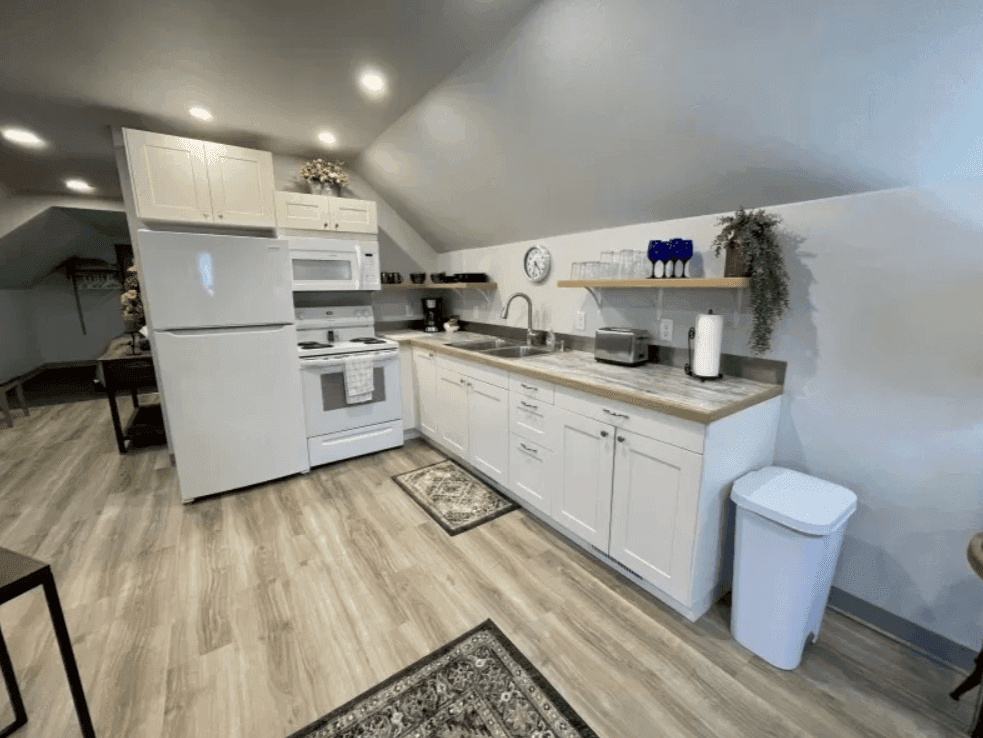 White kitchen cabinets, refrigerator and countertop appliances