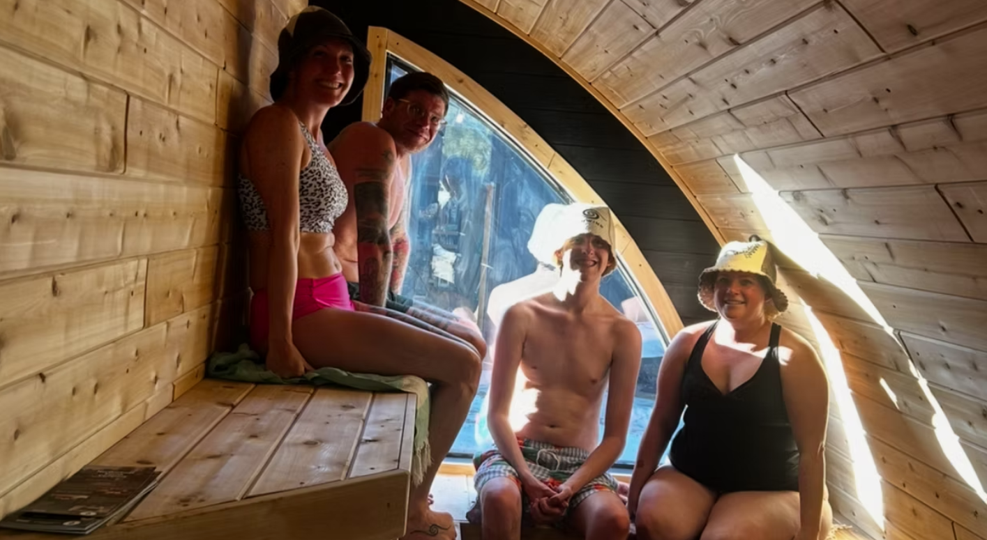 Friends enjoying the inside of a mobile sauna