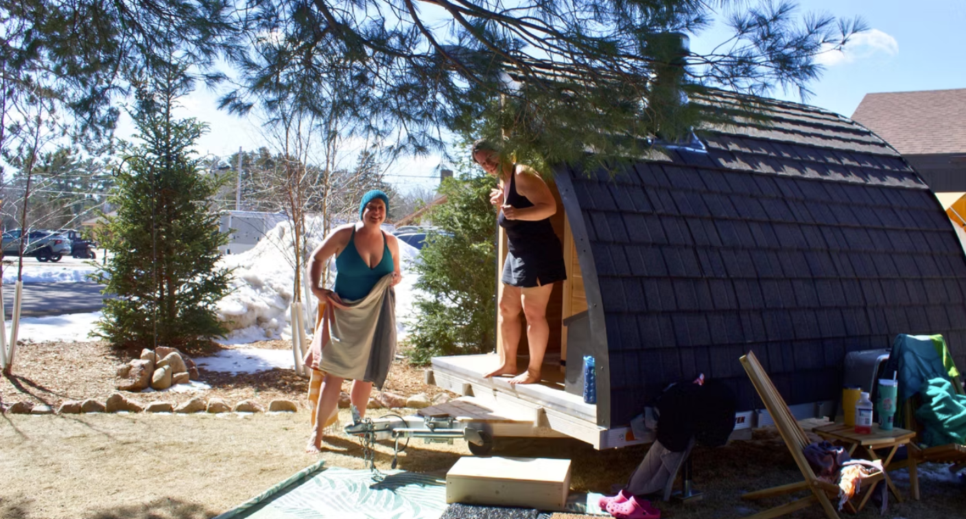 Pod-style mobile sauna with guests